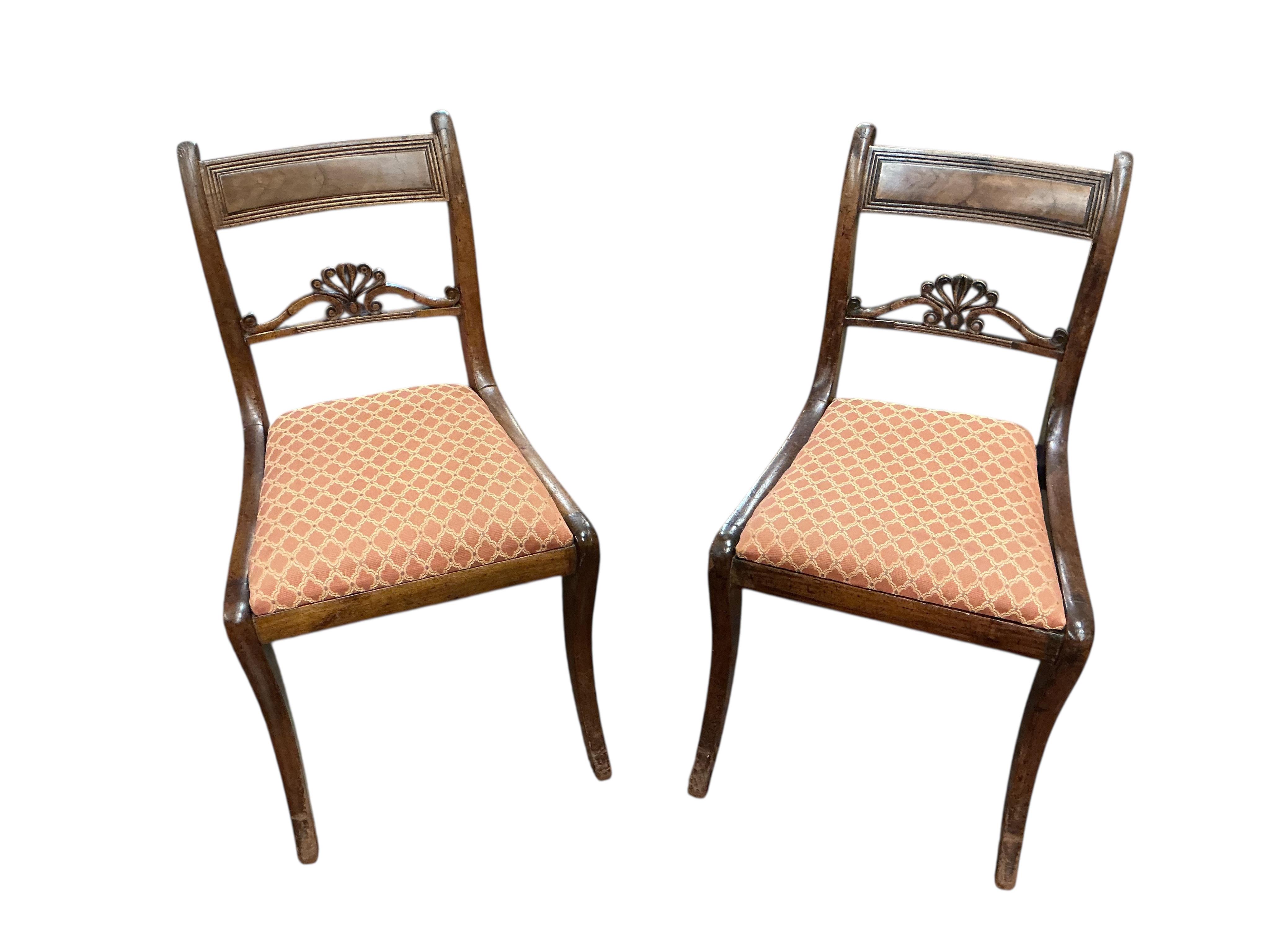 A set of eight Regency mahogany dining chairs, two with arms.